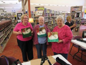 Adults with pumpkin painting